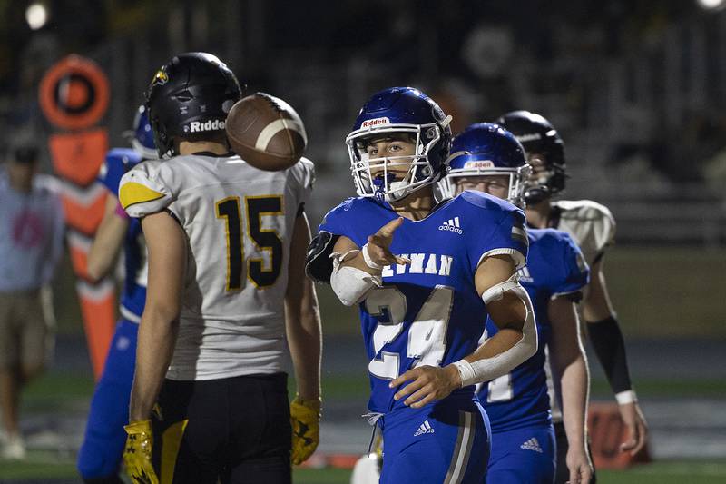Newman’s Ryan Partington tosses the ball after scoring a PAT against Riverdale Friday, October 11, 2024, in Sterling.