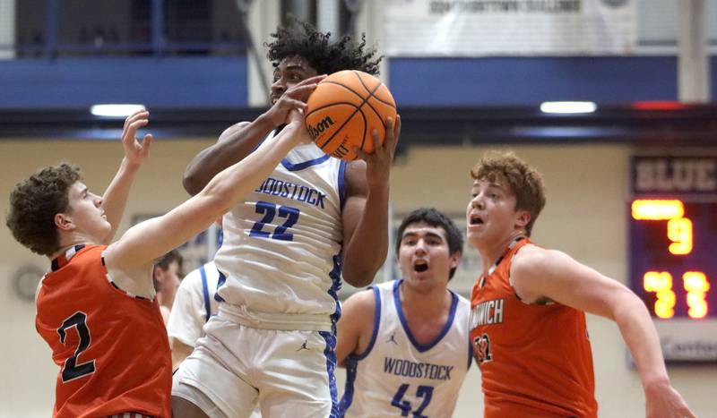 Woodstock’s Tony Grzetic works under the hoop against Sandwich in varsity boys basketball on Tuesday, Feb. 11, 2025, at  Woodstock High School in Woodstock.