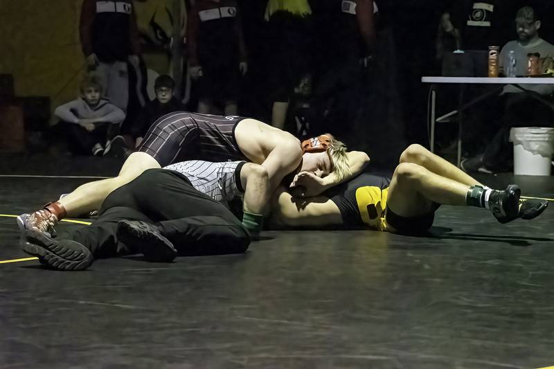 Fulton's Zane Pannell (left) pins Riverdale's Alex Watson during the 170-pound title bout at the 1A Riverdale Regional on Saturday, Feb. 4, 2023.