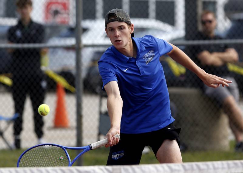 Lincoln-Way East’s Quinn Paris returns the ball as he and his doubles partner, Sam Cooley, compete in the Class 2A Boys State Tennis Tournament on Thursday, May 29, 2025, at Palatine High School.