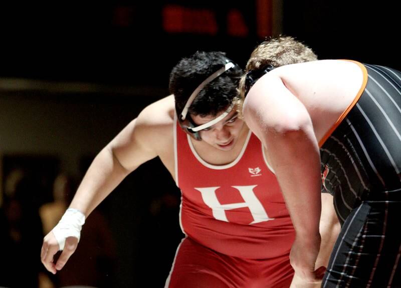 Huntley’s Markos Mihalopolus approaches Crystal Lake Central’s Logan Gough in a 285-pound bout in varsity wrestling at Crystal Lake Friday.  Mihalopolus won the match.