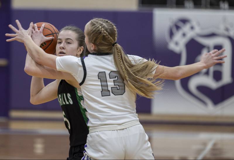 Rock Falls’ Rylee Johnson looks to pass while being guarded by Dixon’s Kait Knipple Wednesday, Feb. 1, 2023.