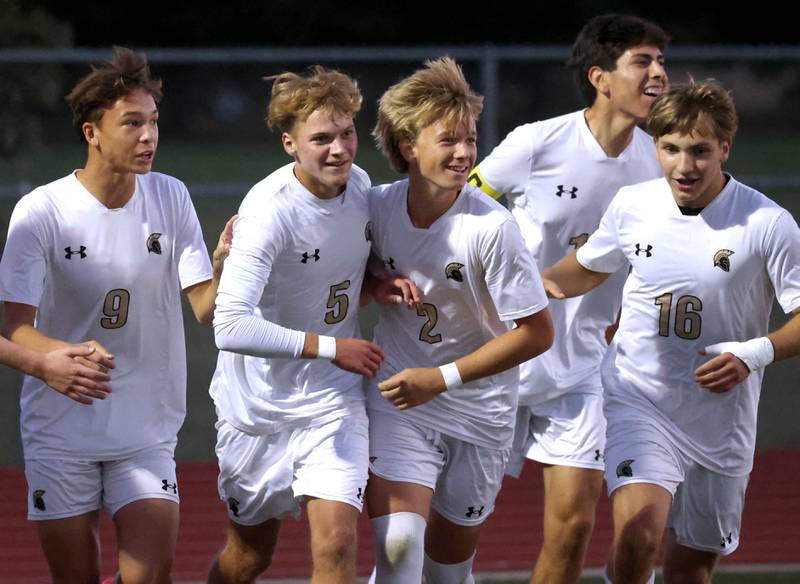 Sycamore players celebrate after scoring the first goal of the game against DeKalb Thursday, Oct. 10, 2024, at DeKalb High School.
