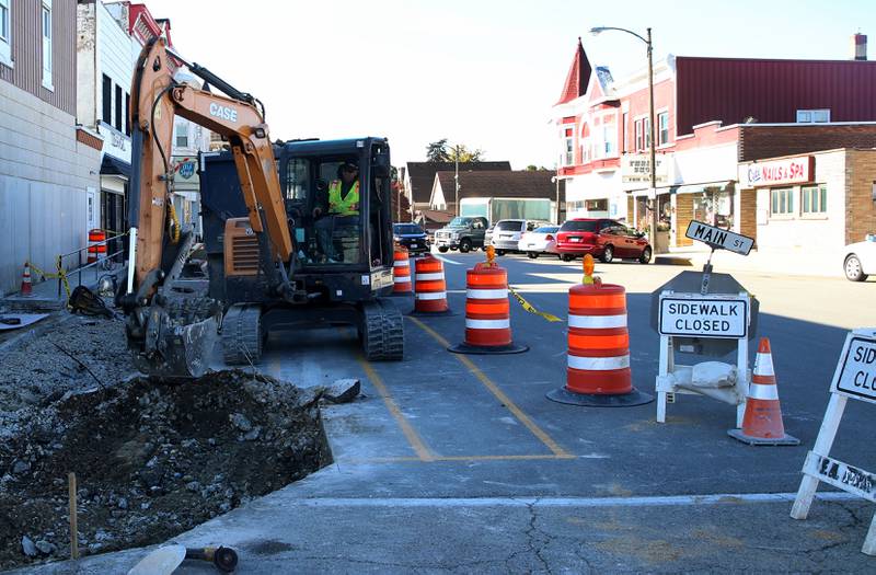 Crews remove chunks of a sidewalk at the corner of Jefferson and Main Street on Monday, Oct. 27, 2025 in Mendota. The City of Mendota is reconstructing sidewalks to comply with ADA accessibility. The project includes 2,100 square feet of sidewalk, 184 feet of curb and gutter, asphalt patching and other miscellaneous improvements.