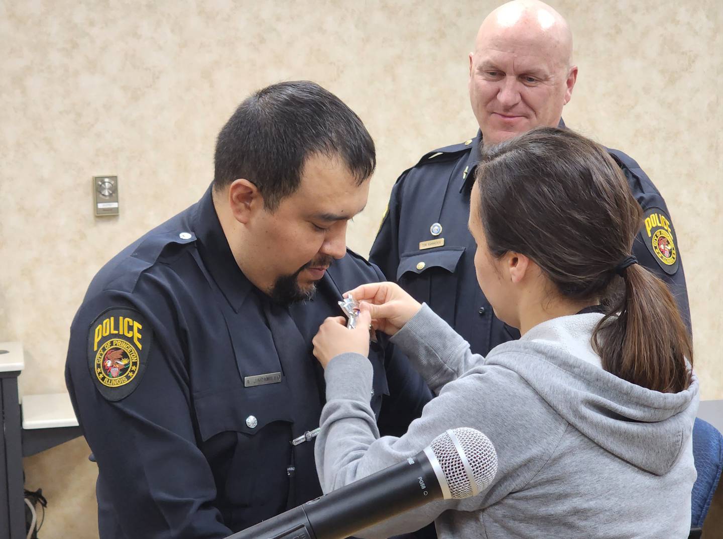 Officer Alex Jaramillo was pinned by his wife, Lorena, during Tuesday's City Council meeting in Princeton.