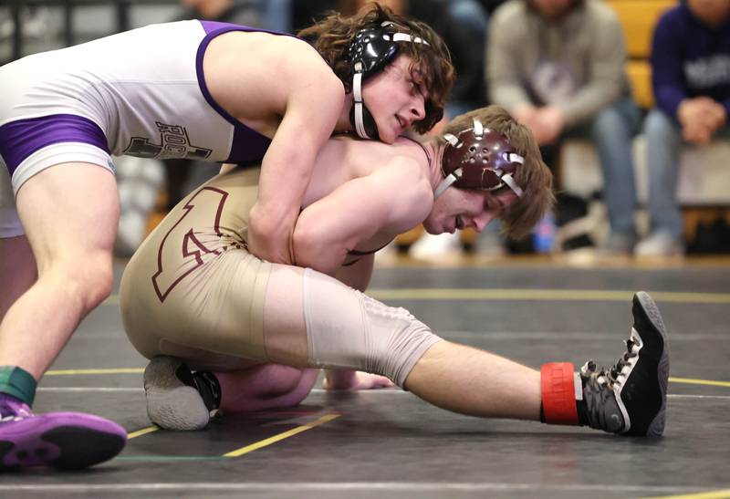 Morris’ Tyler Semlar tries to escape from Rochelle’s Brendan Voight in their 145 pound match Saturday Jan. 21, 2023, during the Interstate 8 Conference wrestling tournament at Sycamore High School.