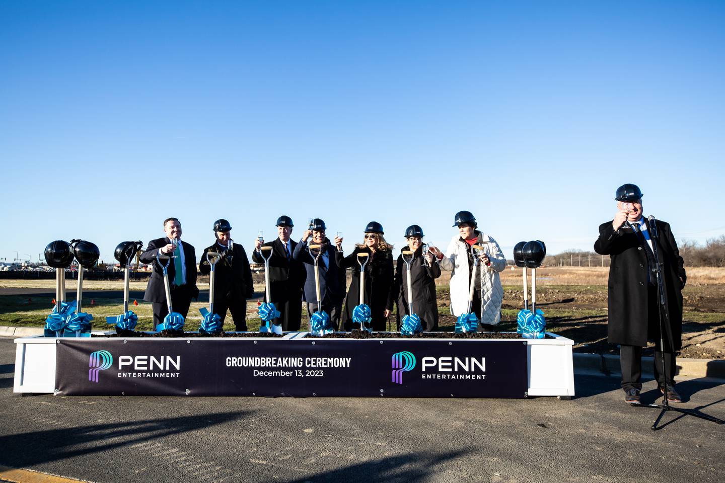 Doug Pryor, Todd George, Joliet Mayor Terry D'Arcy, Rafael Verde, Diane Cullinan Oberhelman, Natalie Manley, Jennifer Bertino-Tarrant and Mike Thoma lead a champagne toast at the future site of Hollywood Casino Joliet on Dec. 13, 2023.