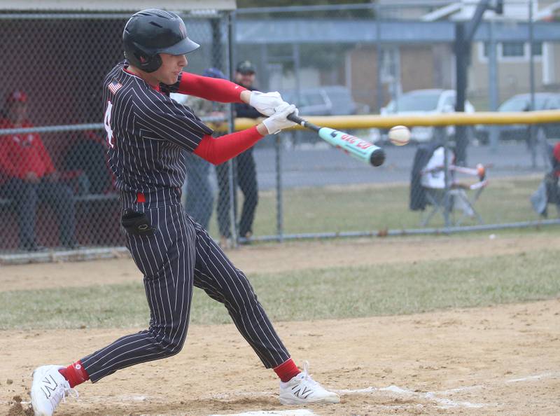 Hall's Luke Bryant makes contact with the ball against Streator on Tuesday, March 18, 2025 in Foley Field at Kirby Park in Spring Valley.