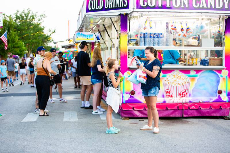 Carey Kogol takes a photo of her daughter Quinn, 8, at The Taste of Westmont on Saturday, July 13.

Suzanne Tennant/For Shaw Local News Media