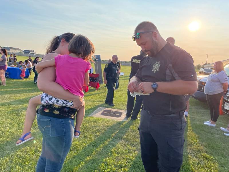 Kendall County Deputy Tristan Borzick meets with members of the community at a previous National Night Out.