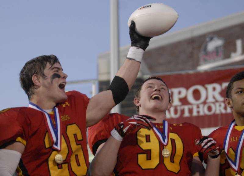 Batavia's Forrest Gilbertson (left) and Ryan Minniti (right) bask in the aftermath of Saturday's 6A state championship win over Richards at Huskie Stadium in DeKalb.