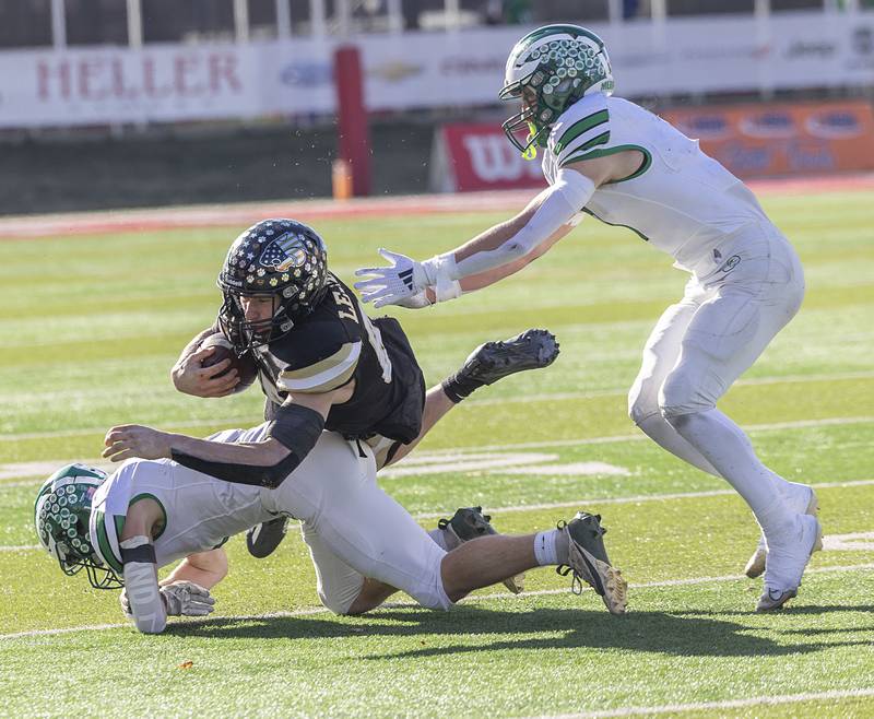 Lena-Winslow’s Aiden Wild fights for yards against the Brown County defense Friday, Nov. 28, 2025, in the Class 1A football finals at Hancock Stadium at ISU.