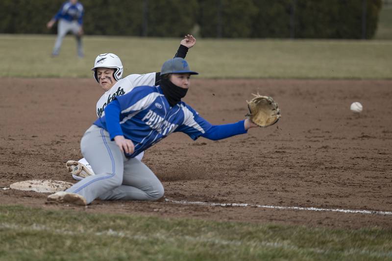 Rock Falls’ Isaiah Kobbeman slides in safely at third as Princeton’s Jordan Reinhardt fields the throw Thursday, March 23, 2023.