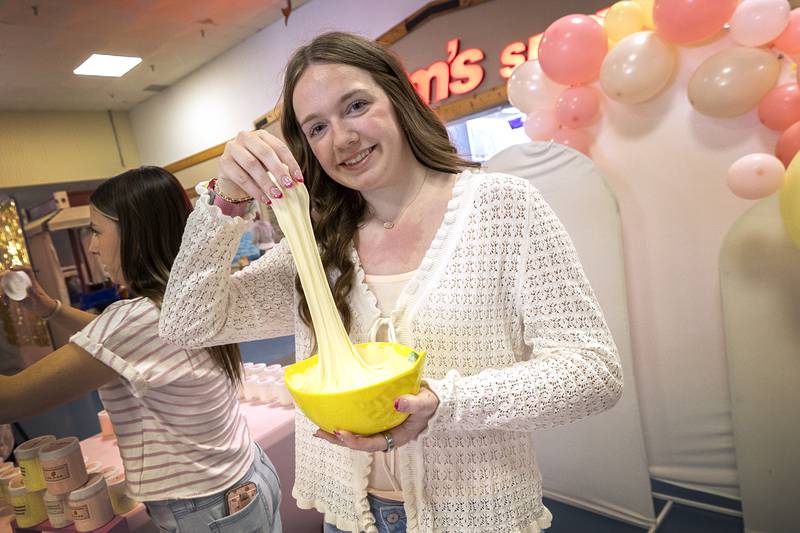 Haleigh Dale, developer of Daleigh Slimes, shows off her product Wednesday, April 29, 2026, at the WACC CEO class trade show. The fun product comes in three scents, strawberry, lemon and confetti. The show is the final step in the class where the students develop a business model to sell their goods or services.
