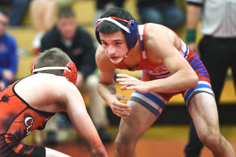 Oregon's Isaiah Perez zeroes in on Amboy's Ty Florscheutz in their 126-pound match  at Oregon High School on Tuesday, Nov. 25, 2025.