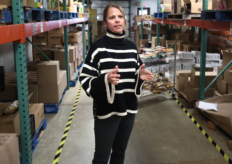 Rooted for Good Executive Director Heather Edwards talks Thursday, Oct. 30, 2025, at the food pantry, about the potential impact on Rooted for Good if SNAP benefits are cut off due to the government shut down and the large influx of new patrons it may bring.