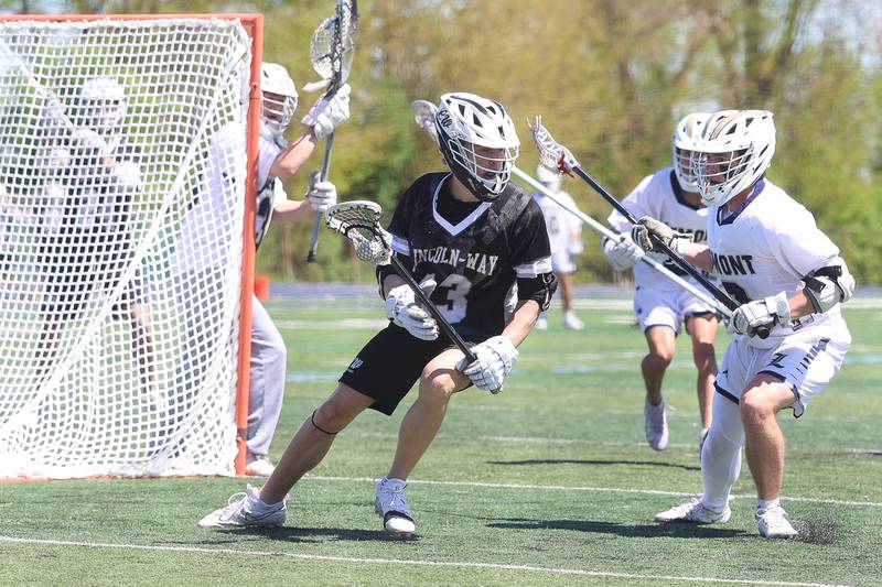 Lincoln-Way’s JB Rottman looks for a play against Lemont on Saturday, April 25, 2026 in Lemont.