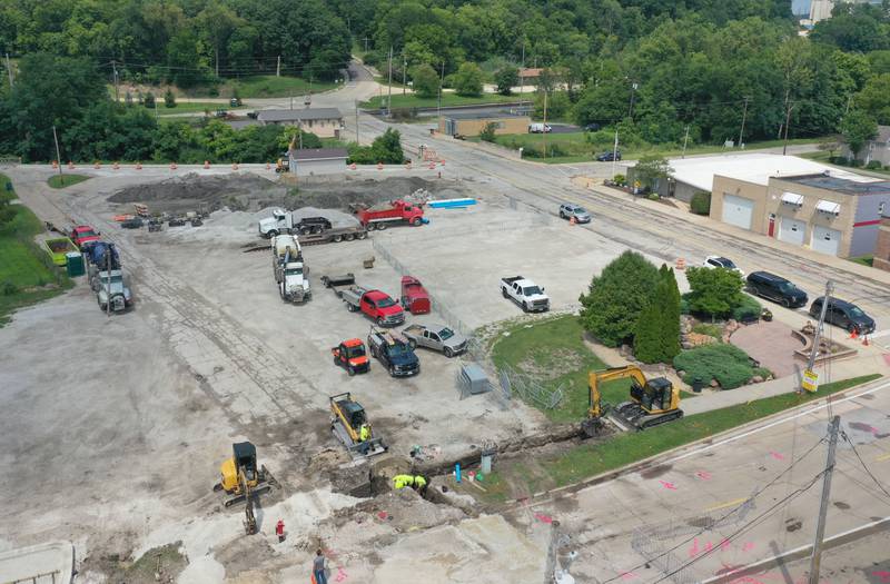 Crews continue to work on the site of the Utica retail plaza near the intersection of Mill and Grove streets on Wednesday, July 24, 2024 in Utica. Workers have begin replacing water lines, adding rock and preparing to redo the the Market on Mill area. The project is scheduled to be completed just before Burgoo.