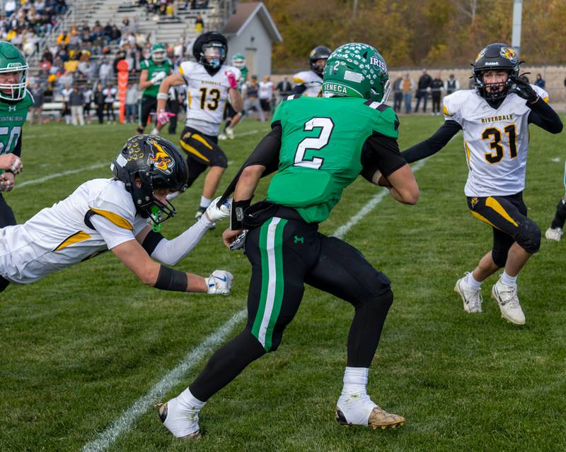 Gunnar Varland (2) of Seneca runs ball as Riverdale defense surrounds him on Saturday, November 1, 2025 at Seneca High School in Seneca.