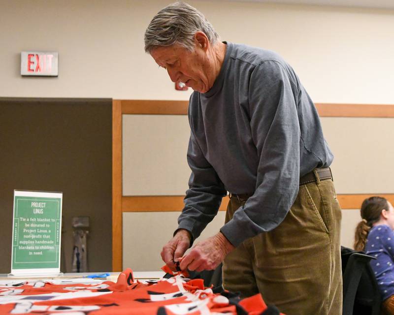John Westberg of Oakbrook helps make handmade blankets on Monday Jan. 20, 2025, that will get donated to Project Linus who create handmade blankets and provide them to children in need held at the Elmhurst Library on Martin Luther King Jr. Day of Service.