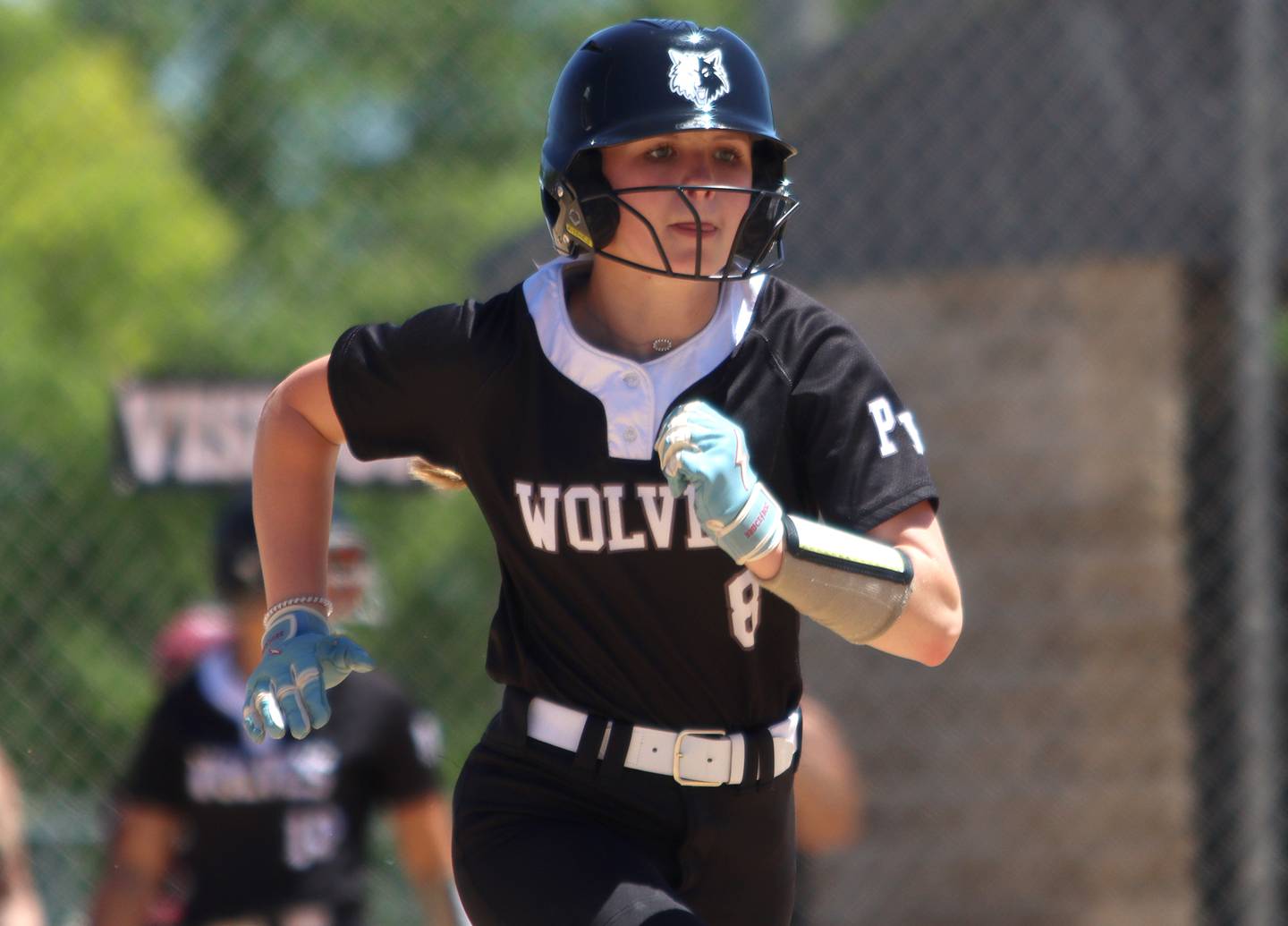 Prairie Ridge’s Ady Kiddy sprints to first after making contact against Harvard during Class 3A softball regional final action at Lions Park in Harvard Saturday.