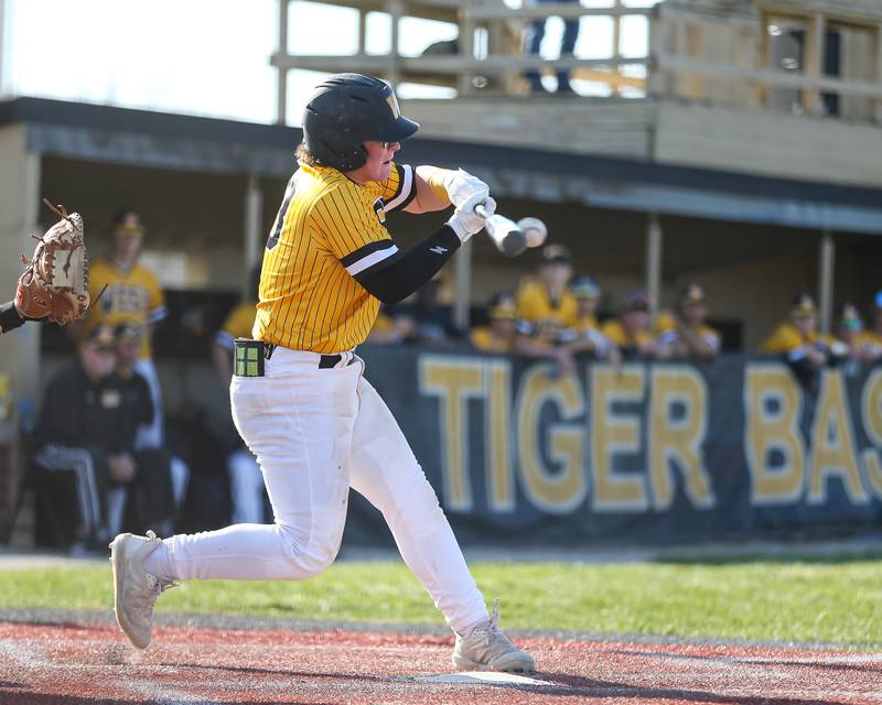 Joliet West's Joliet West's Owen Young (33) puts bat on ball  during varsity baseball game between Oswego East at Joliet West.  April 10, 2023.