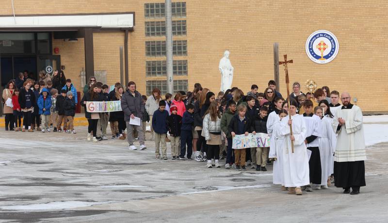 Father Tom Otto (right) leads students from The Academy of St. Carlo Acutis in a Eucharistic Procession to St. Joseph’s Catholic Church on Friday, Jan. 30, 2026 in Peru. Over 350 students and staff from Academy of St. Carlo Acutis celebrated the very first all-school Mass.