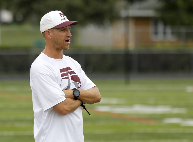 Prairie Ridge Head Coach Mike Frericks  watches his team during football practice against Grant on Thursday, July 17, 2025, at Grant High School in Fox Lake.