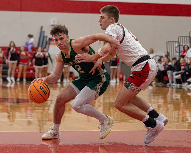 St. Bede's Gus Burr (2) drives ball down lane whilst being guarded by Luke Bryant (4) of Hall on Saturday, January 31, 2026 at Hall High School in Spring Valley.