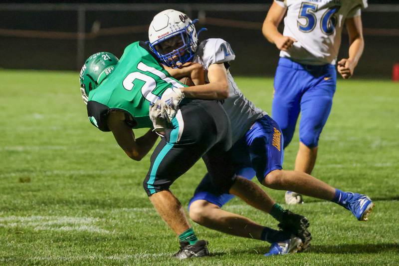 Thomas Milton of Seneca gets tackled by Davis Tyler of Aurora Central Catholic on Friday, September 27, 2024 at Seneca high school in Seneca.