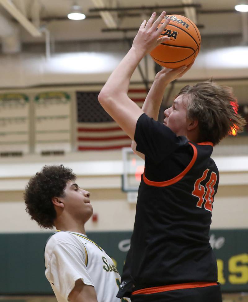 McHenry's Nate Ottaway drives the baseline against Crystal Lake South's Noah Cook during a Fox Valley Conference boys basketball game on Wednesday, Jan. 14, 2026, at Crystal Lake South High School.