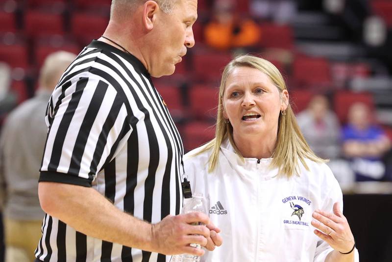 Geneva's head coach Sarah Meadows talks to an official during a timeout in their Class 4A state semifinal game against Benet Friday, March 3, 2023, in CEFCU Arena at Illinois State University in Normal.