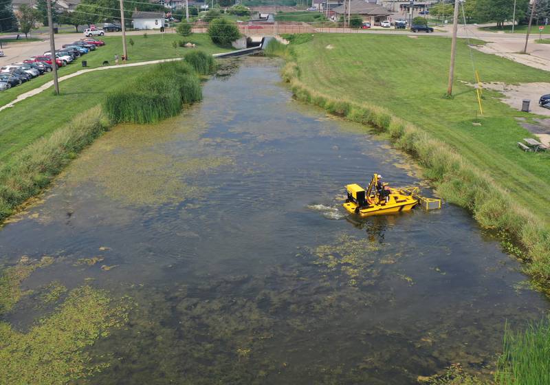 A Weedoo aquatic weed harvester machine removes algae from the Illinois & Michigan Canal on Friday, Aug. 1, 2025 in Ottawa.