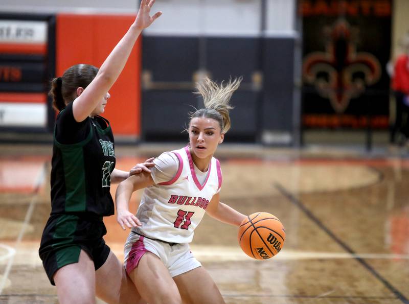 Batavia's Kaidyn King tries to get around Glenbard West's Ellie Noble during the Class 4A St. Charles East Sectional final on Thursday, Feb. 27, 2025 in St. Charles.