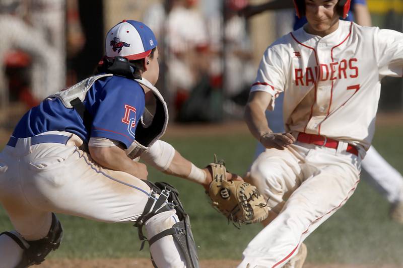 Dundee-Crown's Isaac Grzynkowicz.tags out Huntley's Gavin Rettberg as he tries to score on a bunt during a Fox Valley Conference baseball game on Friday, May 9, 2025, at Huntley High School.