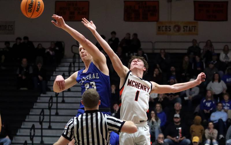 Burlington Central’s Jacob Johnson and McHenry’s Dylan Hurckes tip off to begin the OT period in varsity boys basketball on Tuesday, Feb. 4, 2025, at  McHenry High School  in McHenry.
