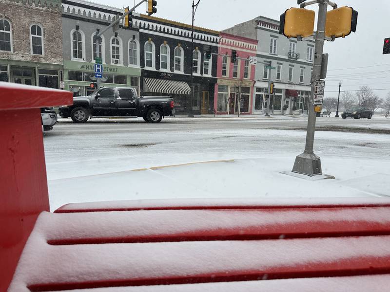 Snow sticks to a large adirondack chair on North Main Street on Wednesday, Feb. 12, 2025 in Princeton.