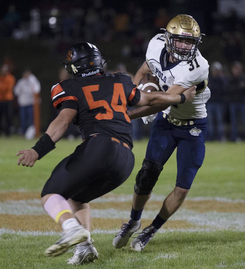 Polo’s Noah Dewey avoids a tackle by Milledgeville’s Dalton Adamec Friday, Oct. 4, 2024, at Milledgeville High School.