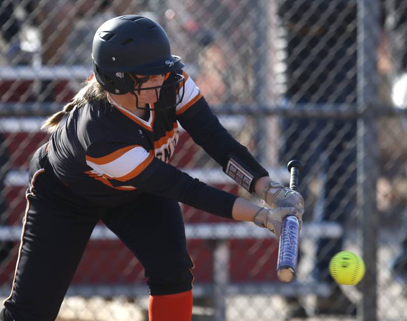 McHenry’s Cooper Ten Bruin lays down a bunt during a non-conference softball game Friday, April 1, 2022, between McHenry and Barrington at Barrington High School.