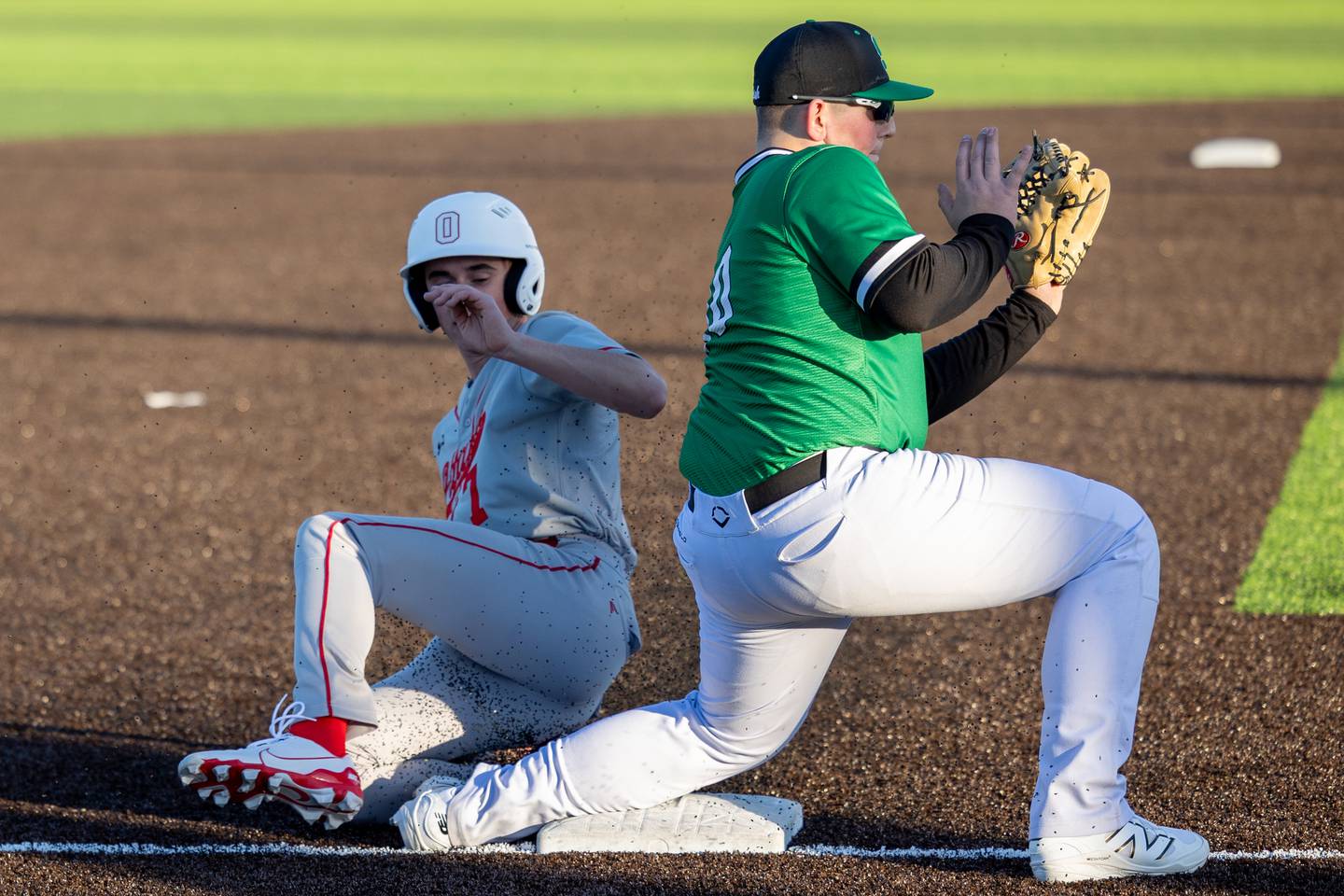 Lucas Farabaugh of Ottawa slides into third base on Monday, March 17, 2025 at Seneca High School in Seneca.