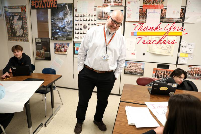 St. Charles East teacher Neil Currie teaches a modern American history class at the school.