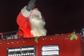 Photos:Santa parades through Utica on a fire engine