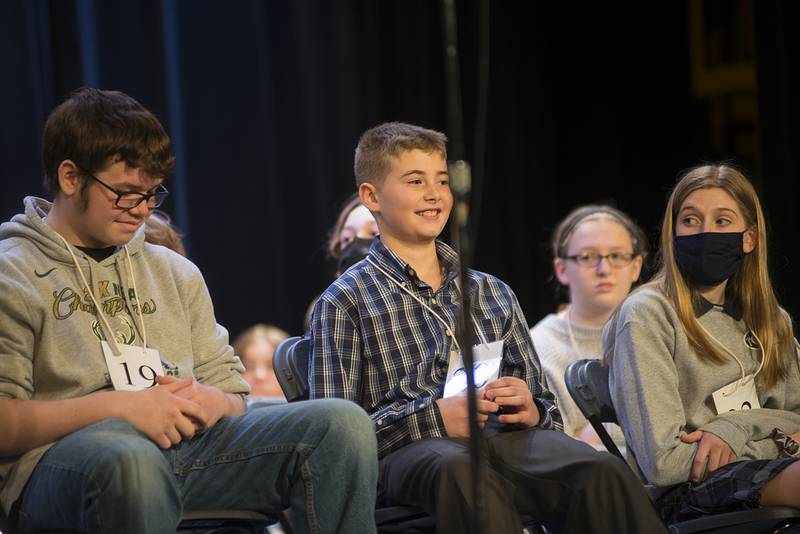 Declan McKinney of Tilton Elementary School smiles after a correct spelling while competing in the Lee-Ogle-Whiteside Regional Spelling Bee Thursday, Feb. 24, 2022. McKinney made it to the top three but misspelled “besieged.”