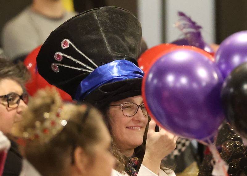 Krysten Kain of West Brooklin, smiles while wearing her hat and listening to her son Spencer sing during the 9th annual NCI Artworks Mad Hatter Ball on Friday, Jan. 16, 2026 at the Westclox Event Center in Peru.