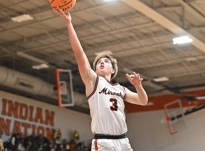 Minooka's Kevin Bisbee (3) goes for a layup during a conference game against Joliet Central on Friday, Jan. 10, 2025, at Minooka.