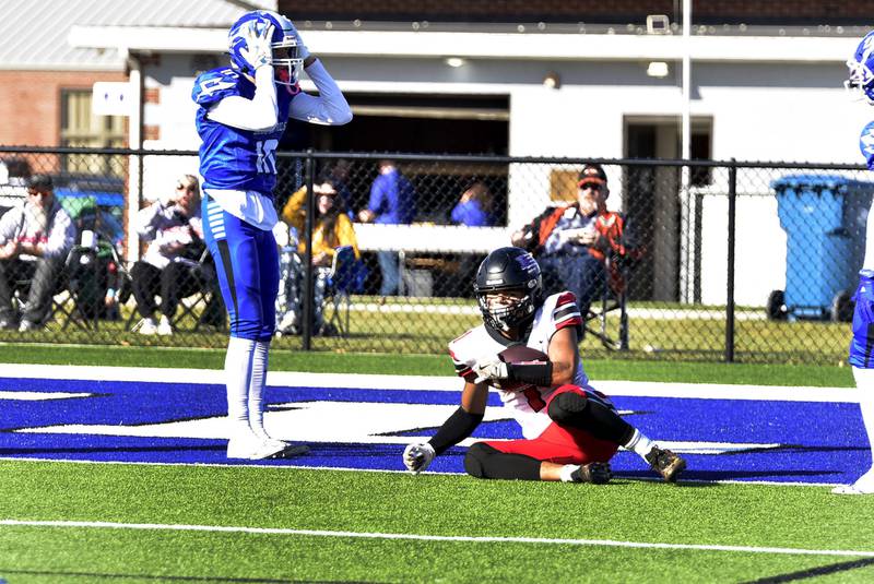Erie-Prophetstown's Demetree Larsen catches a pass inches from the goal line as Bismark-Henning Rossville-Alvin's Payton Wallace reacts during first round action in the 2A state football playoffs on Saturday, Nov. 2, 2024 in Bismark.