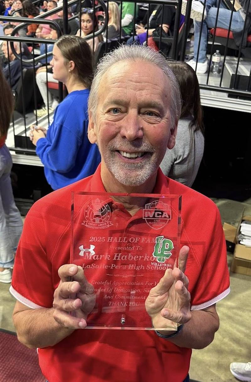 La Salle-Peru volleyball coach Mark Haberkorn was honored at the IHSA state tournament over the weekend for his induction into the Illinois Volleyball Coaches Association Hall of Fame.