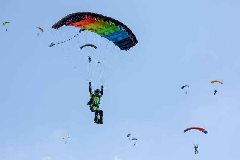 Skydivers glide towards drop zone on Friday, Aug 22, 2025 above Skydive Chicago in Ottawa.