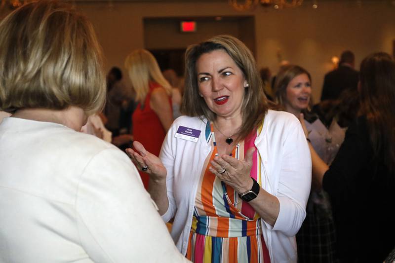 Kim Keefe talks with Maureen Mcintyre during the Northwest Herald's Women of Distinction award luncheon Wednesday June 4, 2025, at Boulder Ridge Country Club, in Lake in the Hills. The luncheon recognized ten women in the community as Women of Distinction.