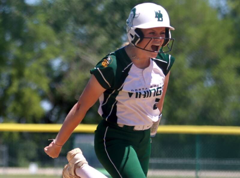 North Boone’s Lauren Stefek celebrates her home run during Class 2A softball sectional final action against Richmond-Burton at Marengo Saturday.